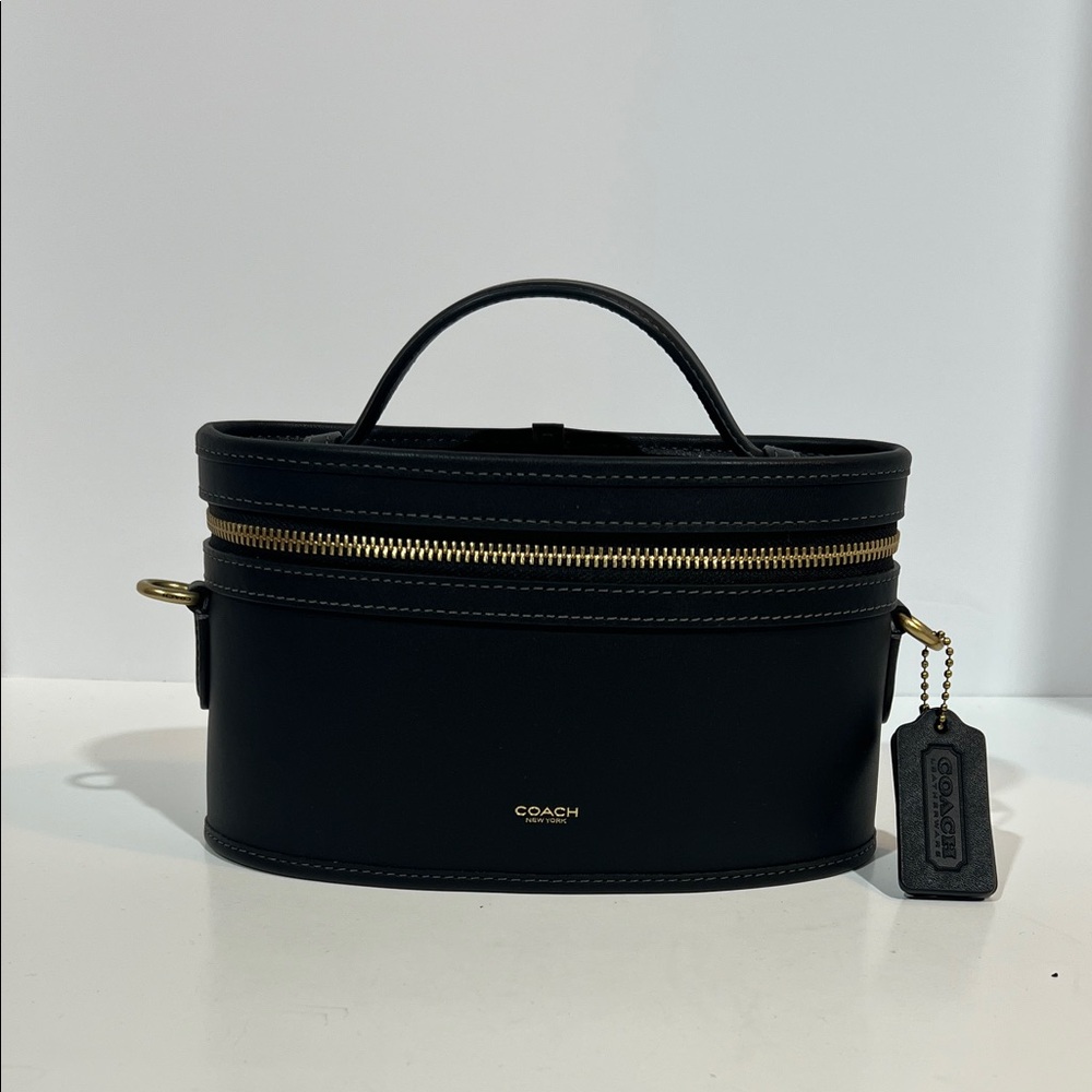 Coach Black “trail” bag with brass hardware